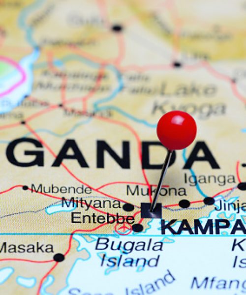 Photo of pinned Kampala on a map of Africa. May be used as illustration for traveling theme.